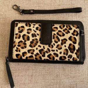 Rachel Roy black leather and animal print wristlet wallet.